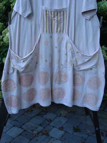 Barclay Farmer Jen Tunic Dress, fallen flower pale pink, size 2. Generously sized dress with shell flower theme paint in lightest pink. Rear elastic tab, oversized bushel front drop pockets, lower bell shape, and deeper rounded neckline. Bust 56, waist 60, hips 66, length 45 inches.