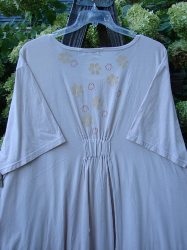 Barclay Farmer Jen Tunic Dress Fallen Flower Pale Pink Size 2: A white shirt with flowers on it, made from organic cotton. Generous measurements, bell shape, and drop pockets.
