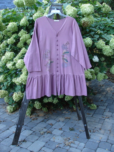 1997 Belladonna Jacket Pocketless Top Hat Crocus Size 2: A purple jacket with a whimsical top hat theme paint. Features 12 tiny textured coordinating knotted buttons and a flirtatious 10-inch bottom flounce. Made from organic cotton.