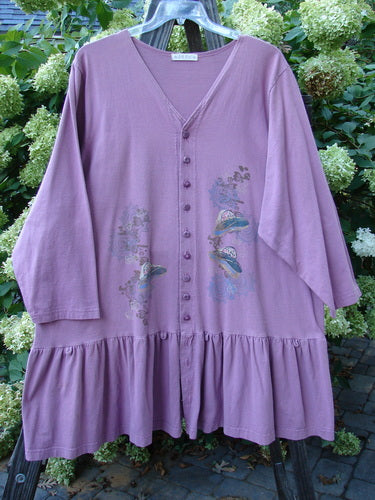 1997 Belladonna Jacket Pocketless Top Hat Crocus Size 2: A purple jacket with a whimsical top hat theme paint. Features a flirtatious bottom flounce. Made from organic cotton.