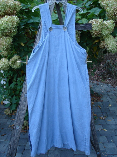 1999 Summercloth Suspender Overall Jumper Unpainted Bluestone Size 1 features sturdy shoulder straps, oversized metal buttons, and deep side pockets, artistically displayed on a ladder with garden blooms.