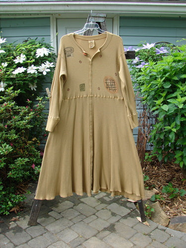Vintage 1995 Thermal Soliloquy Dress by BlueFishFinder: Architectural Burnished Gold Size 2. Mid Weight Cotton with Ribbed Accents. Front Snaps, Sweeping Hemline, Abstract Paint Details. Bust 48, Waist 48, Hips 62.