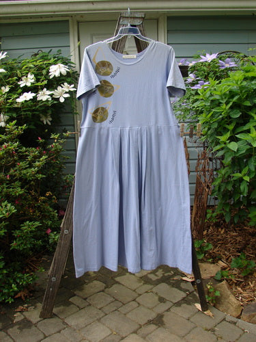 Vintage 1997 Lawn Dress with Geo Theme, Size 1, in Freesia. Features Blue Fish Patch, Tailored Pleats, Drop Waistline, and Organic Cotton. Bust 48, Waist 48, Hips 60, Length 55 inches, Hem Circumference 100 inches.