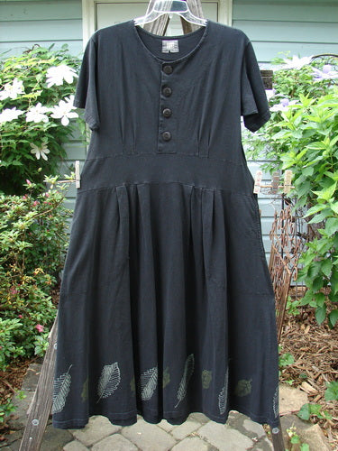 Vintage 2000 LuLu's Dress in Black, Size 0, with Leaf Theme Paint. Organic cotton, yoked waistline, drop pockets, button closure, swingy lower, pleated darts, and unique loops. Perfect for strutting! Dimensions: Bust 44, Waist 44, Hips 58, Hem 100, Length 51.