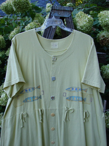 1999 Carry All Dress Double Pike Citron Size 2: A green shirt with fish painted on it. Perfect condition, made from organic cotton. Features 8 original blue fish buttons, front loops with coordinating tie, and a centered rear draw cord. Bust 60, waist 60, hips 64, sweep 90, length 40 inches.
