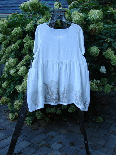 Barclay Linen Studio Pullover Dress Breeze Fern White Size 2: A white dress with a flouncy lower skirt and a drop waistline seam.