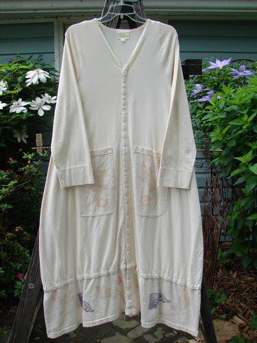 A vintage 2001 T Snap Dress from BlueFishFinder: A white robe on a clothesline, embodying the 2001 Game Piece theme. Features a swing silhouette, A-line shape, offset pockets, and snap tape detailing. Size 1, perfect for creative expression.