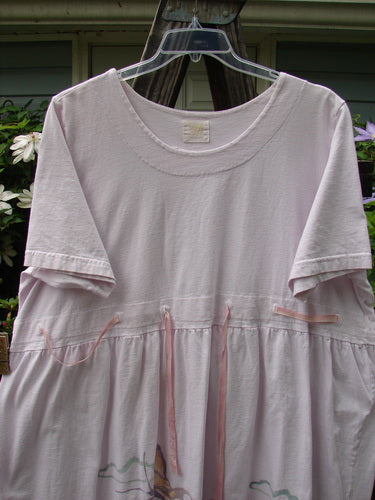 Vintage 1999 Ribbon Dress in Orchid, Size 2, on a clothes hanger. Features a double-paneled neckline and waistline with button accents, replaced ribbon, and butterfly theme paint. Bust 54, Waist 54, Hips 60, Length 36. By BlueFishFinder.