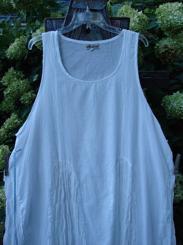 Image alt text: Barclay Batiste Carousel Shift Jumper on swinger, featuring a white tank top. Perfect condition, featherweight cotton. A-line hem, snazzy side cord drawstrings. Size 2.