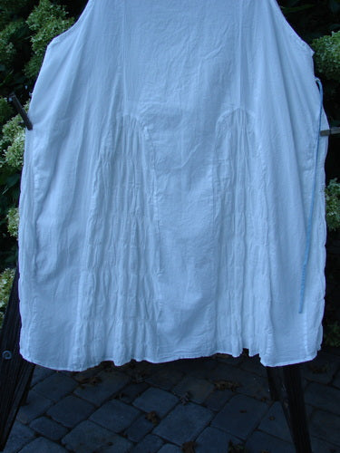 A white skirt on a rack, part of the Barclay Batiste Carousel Shift Jumper Unpainted Stripe White Size 2.