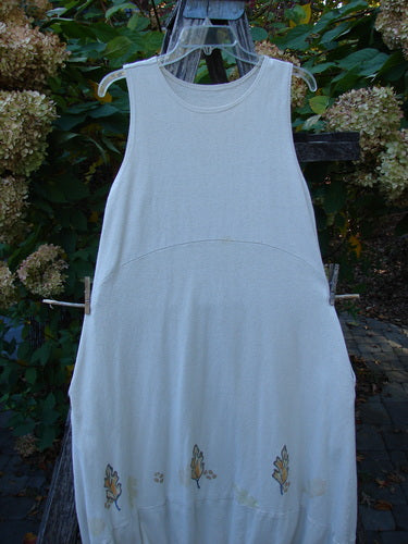 2000 Cotton Hemp Libby Jumper Falling Leaf Dove Altered Size 1, with sleeveless design, leaf motifs on hem, hanging on a wooden ladder, showcasing unique structure and elegant knit texture.