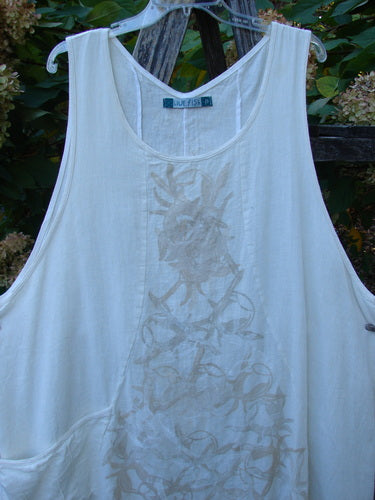 Barclay Slub Figure 8 Lace Pocket Pinafore Dress Soft Floral Crème Size 2 features a sleeveless design with a tonal embroidered stringed instrument pattern and unique figure-eight seams, highlighting Blue Fish's creative vintage style.