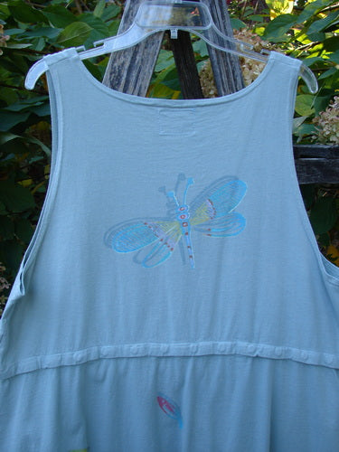 Barclay Little Tree Vest Dragonfly Fish Cucumber Size 1: A sleeveless summer dress with a dragonfly motif, empire waistline, and button front, hanging outdoors, showcasing its unique rounded hemline and slight wear.