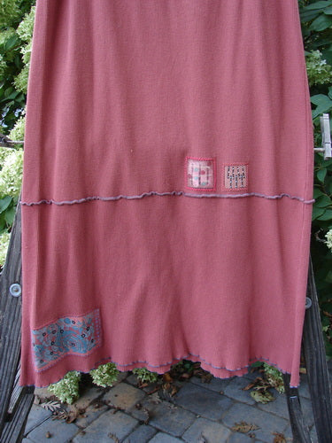 Image alt text: "Barclay Patched Fold Over Ruffle Panel Skirt on clothes rack, with tiny patches along the hem panel and coordinating stripes. Fall Collection, Autumn, Organic Cotton Thermal."