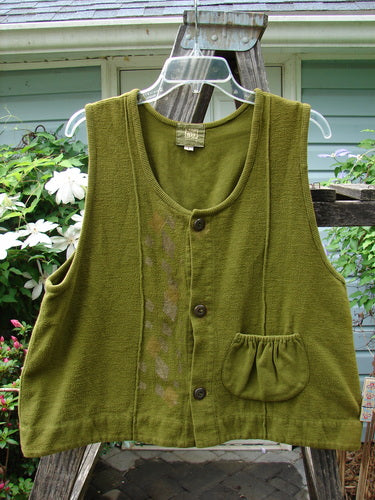 2000 Cylla Vest Diamond Greenroot Size 1, displayed on a hanger. Features include thick flannel, thermal pockets, metal buttons, and a double-paneled hemline. Part of the Winter 2000 Collection.