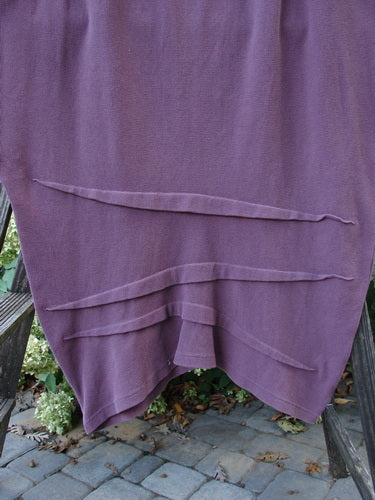 2000 Thermal Awen Skirt Unpainted Murple Size 2: A purple cotton skirt with a textured diagonal hemline, full elastic waistband, and generous hip measurements.
