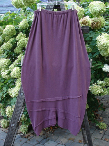 2000 Thermal Awen Skirt Unpainted Murple Size 2: A full elastic waistband purple skirt with a bell shape and textured diagonal hemline.