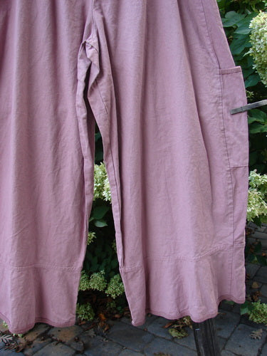A close-up of Barclay Linen Spring Flutter Pant in Rosey Peony, size 2. Features include sectional panels, drop pockets, and a new larger elastic waistline. Unpainted. Waist 32-42, hips 74, inseam 27, length 40.