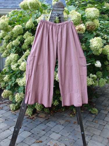Barclay Linen Spring Flutter Pant Unpainted Rosey Peony Size 2: A pair of pants on a clothes line with lower side drop pockets and flutters.