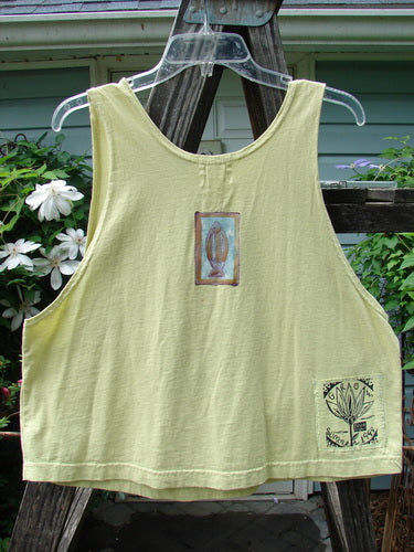 1999 Crop Tank Top Pike Duo Citron Size 0: A yellow tank top featuring a colorful double fish theme paint, with a wide, slightly longer boxy shape and scooped neckline, from Bluefishfinder.com.