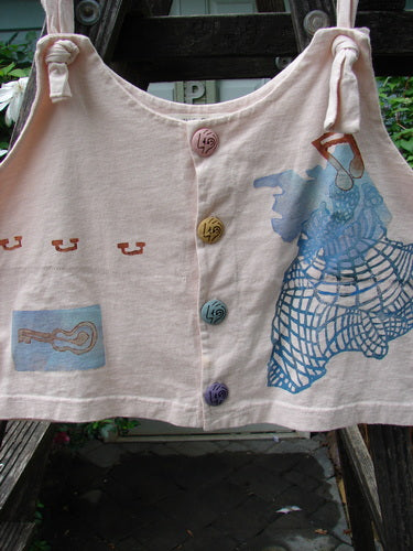 1996 Boxcar Vest Travel Music White Pine Size 1: White vest with adjustable shoulder straps, multi-colored buttons, guitar and music-themed design, and a bright blue patch, perfect as a summer top.