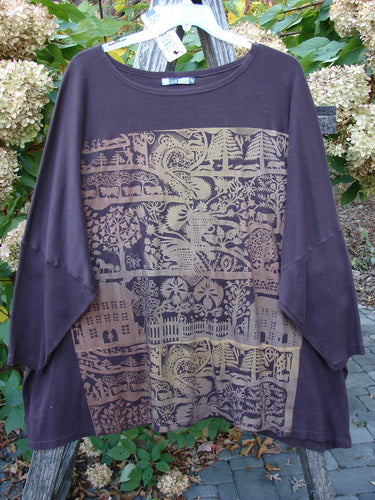 Barclay NWT Modern Square Top Metallic Village Loam Ogo OSFA, featuring a tan graphic with nature motifs on a loose-fitting, dark top, displayed outdoors on a hanger, emphasizing its artistic design.