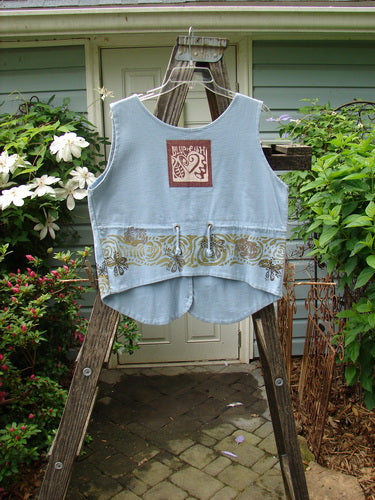 Vintage 1993 The Vest Wind Garden in Periwinkle, altered to size 1. Features include tuxedo-style front tails, heart patch, and wind garden theme paint. Double-layered cotton with original blue fish buttons.