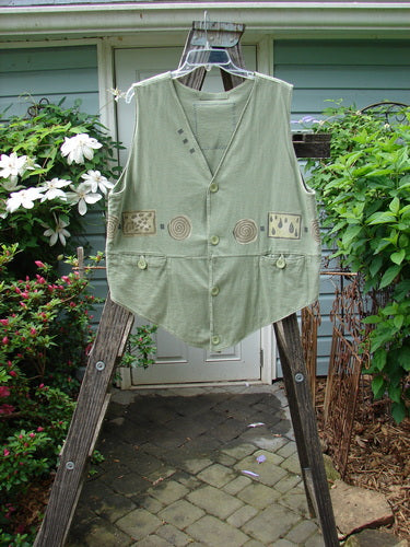 Vintage 1995 Button Vest by Blue Fish in Marsh, altered for a slimmer fit. Features wind and rain theme paint, tiny front buttons, pockets with loop closures, varying hemline, and a unique V-shaped neckline. Crafted from double-layered cotton jersey.