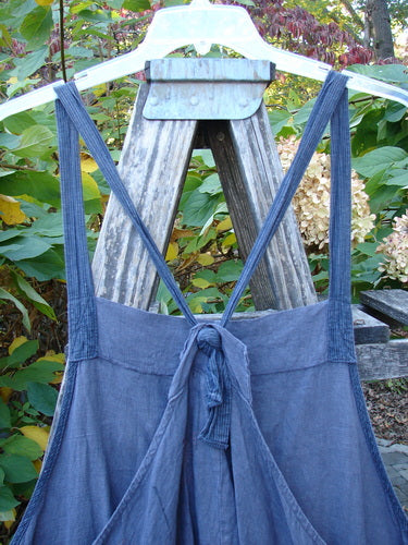 Barclay Linen Apron Jumper Celtic Rain Raven Size 2 displayed on a hanger, featuring unique shoulder straps, a banded bib, tie-back design, and side pockets, embodying BlueFishFinder's vintage-inspired aesthetic.