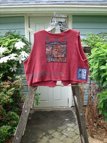 Vintage 1995 Reprocessed Jazz Vest with Altered Size 2, featuring a unique car-themed design by Hollyberry. Made of durable cotton, with a deep V neck, contrasting hemlines, and a signature fish patch. From BlueFishFinder.com.