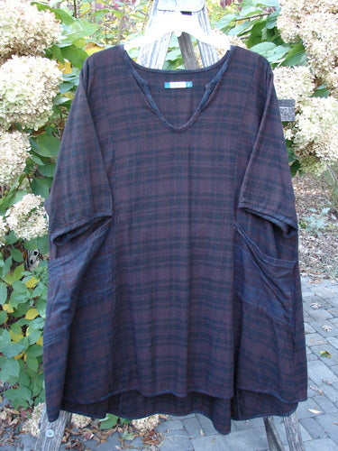 Barclay Flannel Keyhole Drawcord Pocket Dress Brum Plaid Size 2, displayed on a wooden ladder outdoors, features a loose fit, keyhole neckline, wide sleeves, and large patch pockets, perfect for autumn.