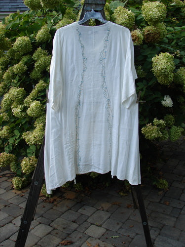 Barclay Linen Venetian Tunic Dress String Light White Size 1: A white tunic dress with a feminine shape, softly dipped V neckline, and double front draw cords. Made from mid-weight linen, it features a beautiful drape and sway. High side vents add to its A-line shape.