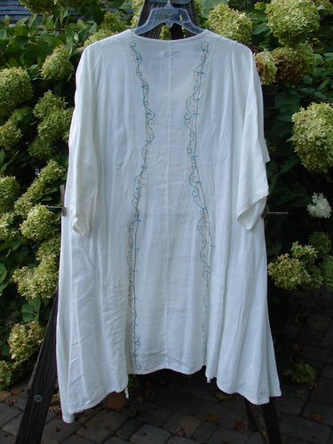 Barclay Linen Venetian Tunic Dress: A white robe with blue embroidery, featuring a feminine shape, A-line silhouette, and double front draw cords. Size 1.