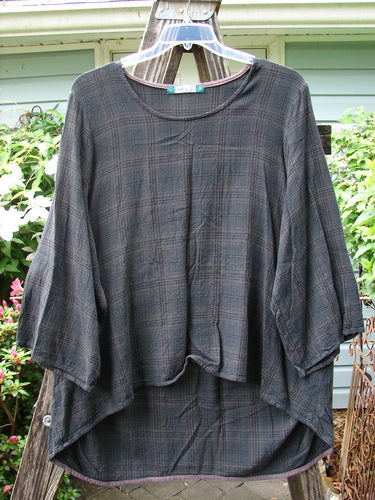 Barclay Linen Rayon High Low Tunic Unpainted Black Plaid Size 2 displayed on a swinger, featuring three-quarter sleeves and a relaxed fit.