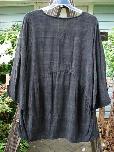 Barclay Linen Rayon High Low Tunic in Unpainted Black Plaid, Size 2, displayed on a hanger with three-quarter sleeves and a relaxed fit.