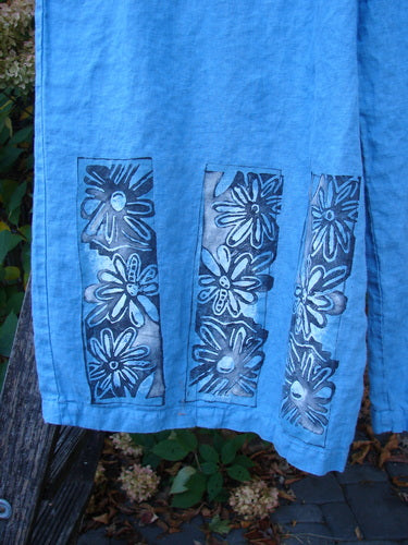 Barclay Linen Wide Leg Crop Pant Daisy Trio Cornflower Size 2: Blue-dyed fabric with three panels of stylized daisies, wide legs, elastic waist, flowing, pocketless, slight crop length, showcasing vintage Blue Fish Clothing creativity.