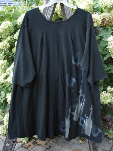 A black Barclay Hi Low Tunic Top with a picture on it, featuring a rounded soft neckline, varying hemline, and longer three-quarter length sleeves. Size 2.