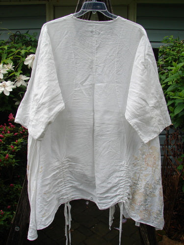 Barclay Linen Venetian Vented Tunic Dress with three-quarter sleeves on a clothesline, showcasing soft side floral white design, size 2.