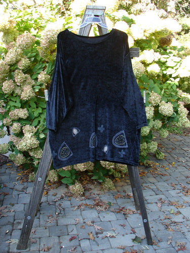 Image alt text: "1996 Velvet Mythical Top in Ebony, a black shirt on a wooden stand, from Bluefishfinder.com"