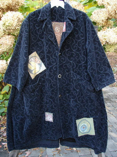 1998 Patched Tapestry Coat Bountiful Sun Guy Black OSFA: Knee-length, loose-fit coat with swirl motif, wide lapels, three buttons, patch pockets, and contrasting appliqués, showcasing vintage Blue Fish artistry.