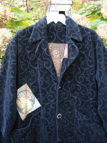 1998 Patched Tapestry Coat Bountiful Sun Guy Black OSFA, featuring a rich swirl-patterned damask, contrasting floral patch on pocket, stand-up collar, angular pockets, vintage buttons, and oversized interior Blue Fish signature patch.