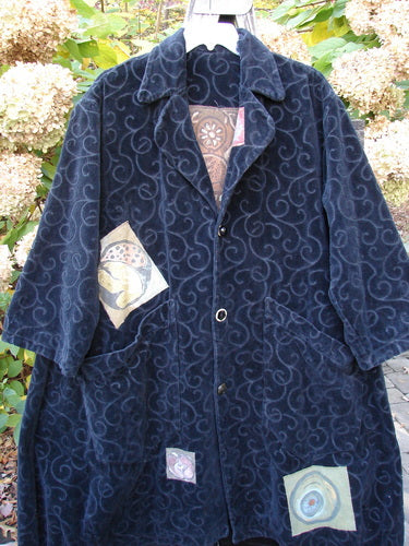 1998 Patched Tapestry Coat Bountiful Sun Guy Black OSFA: A mid-length, dark-blue coat with light-blue swirls, three buttons, abstract appliqués, and large patch pockets, showcasing Bluefishfinder's vintage creativity.