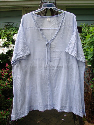 Barclay Batiste Deep Neck Tie Dress Unpainted Lilac Size 2 displayed on a clothes rack.