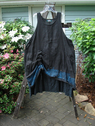 Barclay Linen Two Tier Venetian Eyelet Dress Pinwheel Black Size 2 displayed on a wooden rack, highlighting the intricate design and craftsmanship emblematic of Blue Fish Clothing's vintage-inspired creative freedom.