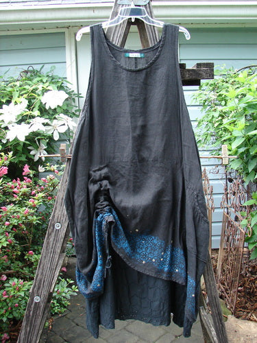 Barclay Linen Two Tier Venetian Eyelet Dress Pinwheel Black Size 2 displayed on a wooden rack.