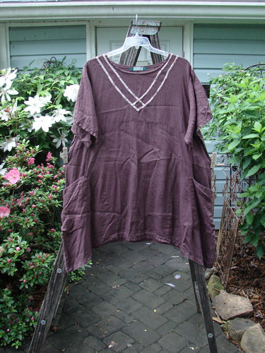 Barclay Linen Ditsy Cross Over Urchin Pocket Dress Burgundy Size 2 displayed on a hanger against an outdoor background.