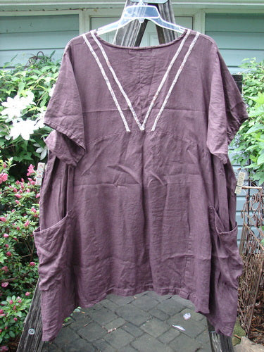 Barclay Linen Ditsy Cross Over Urchin Pocket Dress Burgundy Size 2, short-sleeved, displayed on a clothes rack, showcasing its pockets and pattern.