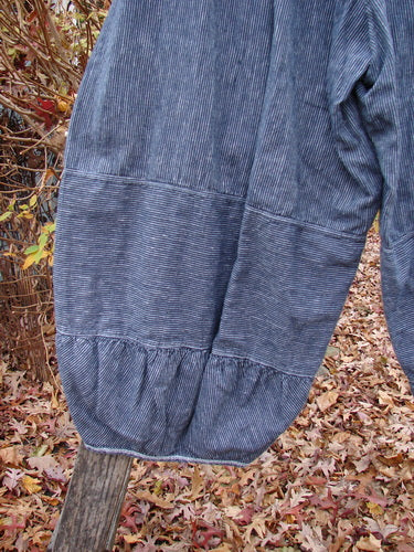 Barclay Hemp Cotton Meadow Pant Unpainted Black Stripe Size 1 displayed outdoors, highlighting its horizontal panel seams, elastic waist, and gathered lower hem, embodying BlueFishFinder's vintage, expressive style.