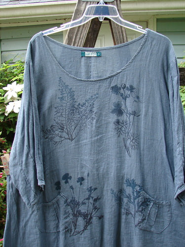 Barclay Linen Pinch Pocket Dress in Shadow Sprig Storm Blue, Size 2, featuring a three-quarter sleeved design with a floral pattern, displayed on a hanger.