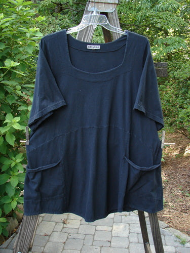 A black Barclay Be There Top, size 1, made from organic cotton. Features include a double paneled neckline, empire waist seam, wide pleats, and a flowing skirt. Bust 52, waist 54, hips 58, hem circumference 80, length 29.